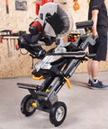 Lightweight Universal Miter Saw Stand With 330 Lb Capacity, A Real Workhorse, with saw mounted, in workshop setting.