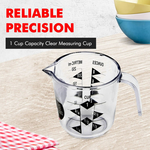 Clear Plastic Measuring Cup With Easy Read US And Metric Markings, 1 Cup Size, Durable Dishwasher Safe, close-up on wooden surface