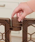 Adjusting latch of Super Wide 192 Inch Baby Gate And Play Yard System, 2 In 1 6 Panel Hardware Mounted Gate, close-up view.