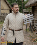 Man holding medieval bracers for cosplay and reenactments, fully functional arm guards with splinted steel, Viking inspired armor.