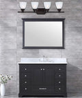 Four Light Bathroom Vanity Fixture In Oil Rubbed Bronze With White Alabaster Glass in a modern bathroom setting, above sink