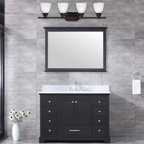 Four Light Bathroom Vanity Fixture In Oil Rubbed Bronze With White Alabaster Glass in a modern bathroom setting, above sink