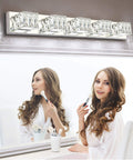 Woman using makeup under 5 Light Crystal Chrome Vanity Light Bar for Bathrooms Dimmable LED Fixtures 30W Cool White Wide 34.6 Inch Over Mirror Restroom Lighting for Cabinets and Sinks.