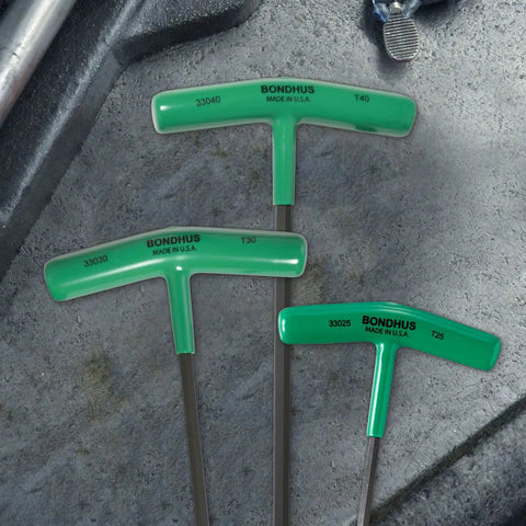 Three sizes of the Eight Piece Star T Handle Set With Graduated Lengths T9 Through T40, Heavy Duty Solid Steel Construction, shown on concrete surface