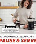 Person using Five Cup Coffee Maker With One Touch Brew Pause And Serve Function Keeps Warm As You Sip Stainless Steel Accents Black Finish