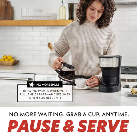 Person using Five Cup Coffee Maker With One Touch Brew Pause And Serve Function Keeps Warm As You Sip Stainless Steel Accents Black Finish