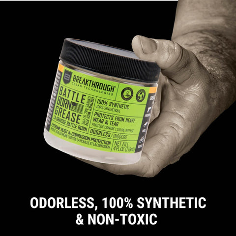 Hand holding 4 oz jar of High Performance Gun Grease With PTFE For Firearms Lube, Rust And Corrosion Protection For Rifles And Handguns