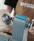No Nonsense Heavy Duty 4 Inch Steel Wood Lathe Faceplate With 1x8TPI Spindle on lathe holding wood for turning.