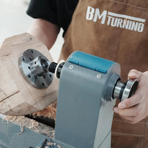 No Nonsense Heavy Duty 4 Inch Steel Wood Lathe Faceplate With 1x8TPI Spindle on lathe holding wood for turning.