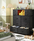 Modern Black Dresser For Bedroom With Built In Charging Station And Bright Led Lights Ten Drawer Storage Cabinet in a cozy room setting.