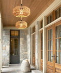 Two Pack Mini Rattan Plug In Pendant Lights Hand Woven Boho Ceiling Fixture With Switch, hung above stone entryway.