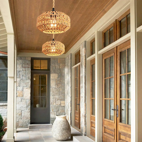 Two Pack Mini Rattan Plug In Pendant Lights Hand Woven Boho Ceiling Fixture With Switch, hung above stone entryway.