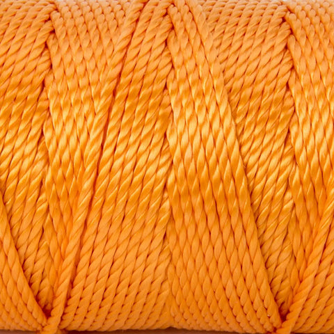 Close-up of fluorescent pink twisted mason line, size 18, 425 feet polypropylene string, used in masonry jobs, general construction, gardening, DIY projects.