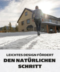 Person walking on snow wearing Battle Ready Ice Traction Cleats For Walking Running And Hiking Stainless Steel Spring Coils.