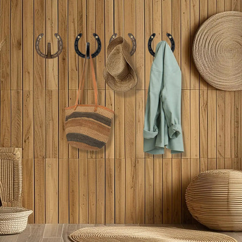 Heavy Duty Cast Iron Horseshoe Wall Hooks Wild West Coat And Hat Rack holding a jacket, hats, and a bag on wood wall.