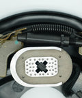Close-up view of two 10-inch electric trailer brake magnets on backing plate for Dexter-type brakes with coil springs.