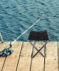 Grab And Go Portable Folding Stool And Camping Bench Silver Lightweight Retractable Outdoor Seat for adults on fishing dock.