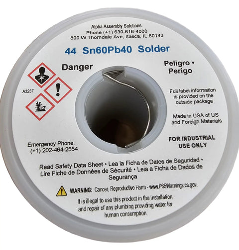 Close-up of Leaded Solder Wire 60/40 Sn60Pb40 0.031 Inch Diameter Rosin Flux 44 Core spool with safety labels visible.