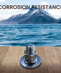 Front view of stainless steel bolt with large flat washer and nut on a wooden surface, ocean and mountains in the background.