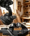 User holding tool with grippy soft jaws on Badass 3.2 Inch Bench Vise With Fully Swiveling 360 Rotation for woodworking tasks.