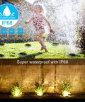 Child playing in sprinklers with 8 Pack Solar Ground Lights Waterproof IP68 for Pathway and Yard Lit Warm White Landscape Lighting