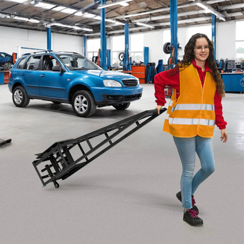 Person moving a Pair Of Hydraulic Car Ramps With Wheels, Heavy Duty 5 Ton Lift Ramps For Oil Changes, in a garage setting