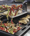 Rust Resistant Outdoor Griddle Insert Full Size Pre Seasoned Carbon Steel Griddle for Searwood and Large Spirit Series Gas Grills in use