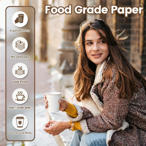 Woman holding 8 Oz Disposable Paper Coffee Cups, 100 Count, Leakproof White Cups For Hot Or Cold Drinks outdoors
