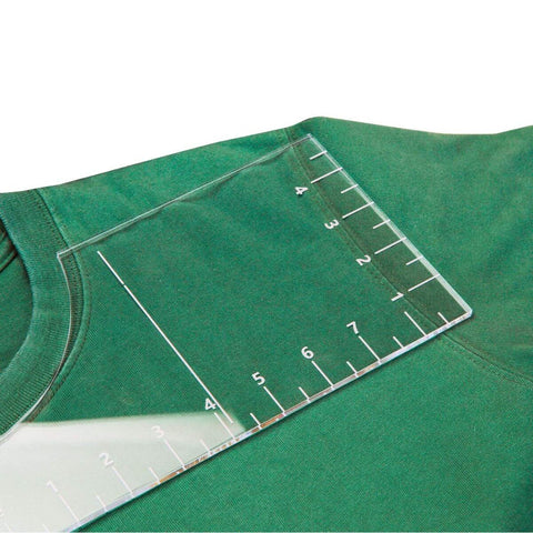 Pro T Shirt Ruler Guide For Easy Accurate Alignment Of Vinyl And Sublimation Designs On Shirts With Built In Size Chart shown on a green shirt