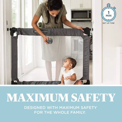 Woman setting up Go With Me Portable Mesh Baby Gate in doorway, expandable from 30 to 48 inches in charcoal tweed, with baby nearby.