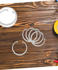 5 Piece Stainless Steel Internal C Clip Snap Ring Set For Shafts And Pins displayed on a wooden table