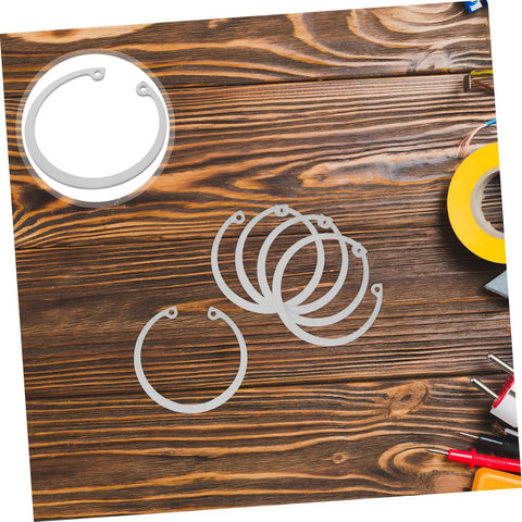 5 Piece Stainless Steel Internal C Clip Snap Ring Set For Shafts And Pins displayed on a wooden table