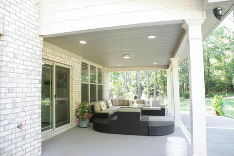 Outdoor Flush Mount LED Ceiling Light For Porches And Walkways, 4000K Cool White, Dark Bronze Exterior Fixture on a covered patio