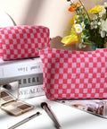 Large Checkered Makeup Bag Canvas Cosmetic Organizer For Travel And Daily Use Rose Red Design with makeup brushes and eyeshadow nearby