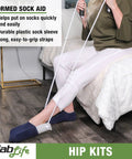 Woman using sock aid from Hip Recovery Daily Living Kit With 26 Inch Reacher Sock Helper Bath Sponge Stick Shoehorn Dressing Stick And Grabber