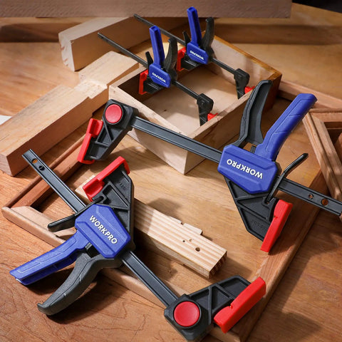 Go-To Mini Bar Clamp Set For Woodworking, Four-Piece One-Handed F Style Quick-Change Clamps on wooden workbench