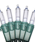Five cool white LED string lights on green wire, part of 26.9 ft Cool White LED String Lights For Indoor Outdoor Decor Green Wire