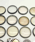 Solid Haul Of Dial Test Indicator Spare Parts And Heavy Duty Hardware For Precision Measuring Tools BR11576CZ5 spare lenses on a white surface.