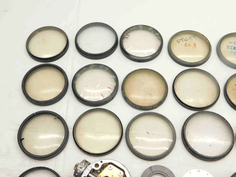 Solid Haul Of Dial Test Indicator Spare Parts And Heavy Duty Hardware For Precision Measuring Tools BR11576CZ5 spare lenses on a white surface.