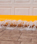 HydraBarrier Supreme Flood Barrier 12 Feet Long 20 Inches Wide 12 Inches High Water Diversion Tube in use at garage door