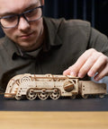 Mini Locomotive 3D Puzzle For Adults Hands On Wooden Train Model Kit Rubber Band Powered Mechanical Puzzle With 172 Pieces Easy DIY Craft Project For Home Workshop And Train Enthusiasts Pure Fun, man assembling wooden train