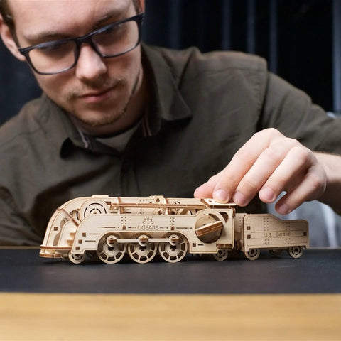 Mini Locomotive 3D Puzzle For Adults Hands On Wooden Train Model Kit Rubber Band Powered Mechanical Puzzle With 172 Pieces Easy DIY Craft Project For Home Workshop And Train Enthusiasts Pure Fun, man assembling wooden train