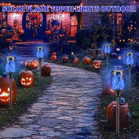 Blue Flickering Flame Solar Torches Lights 4 Pack For Outdoor Yard Garden Waterproof Pathway Patio Decor along a pathway