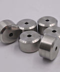Six silver aluminum spacers with through-hole bore, group shot.