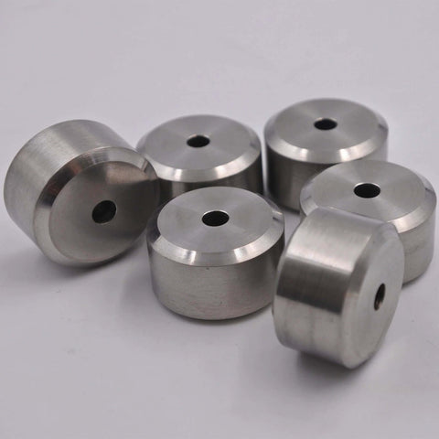 Six silver aluminum spacers with through-hole bore, group shot.
