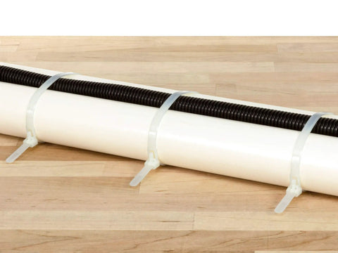 Twelve Inch Natural Releasable Cable Ties Reusable Nylon Zip Ties With Gnarly Tight Fifty Pound Hold In A Dope Hundred Pack for bundling black and white cables.