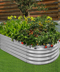 Heavy Duty Galvanized Raised Garden Bed Kit For Veggies, Oval 4 By 2 By 1.5 Feet Outdoor Planter Box in use with flowers and plants