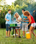 People enjoying a barbecue surrounded by a set of 4 outdoor metal torch lights with 22oz fuel capacity on 5 prong grounded stakes.