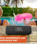Flip 6 Portable Bluetooth Speaker with Loud Power and Deep Bass, IPX7 Waterproof, by a poolside