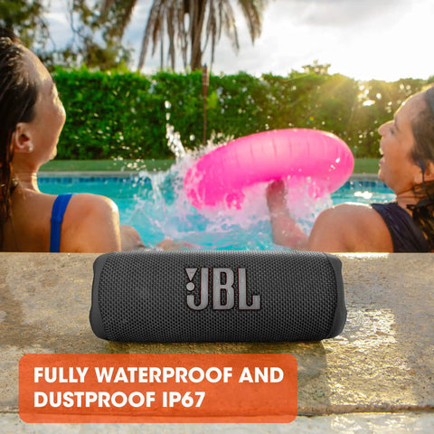 Flip 6 Portable Bluetooth Speaker with Loud Power and Deep Bass, IPX7 Waterproof, by a poolside